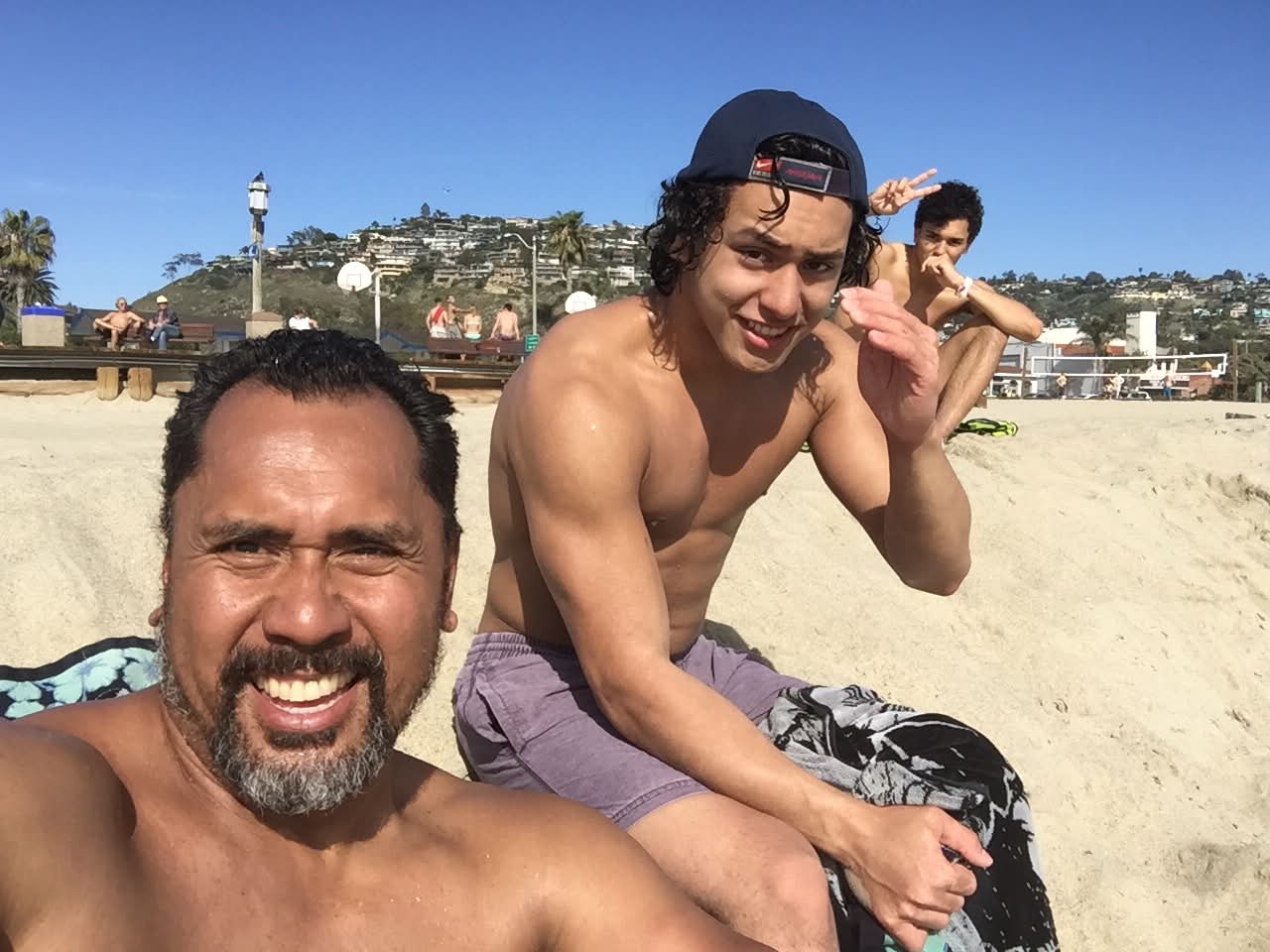 Dad with the boys at Laguna Beach volleyball courts