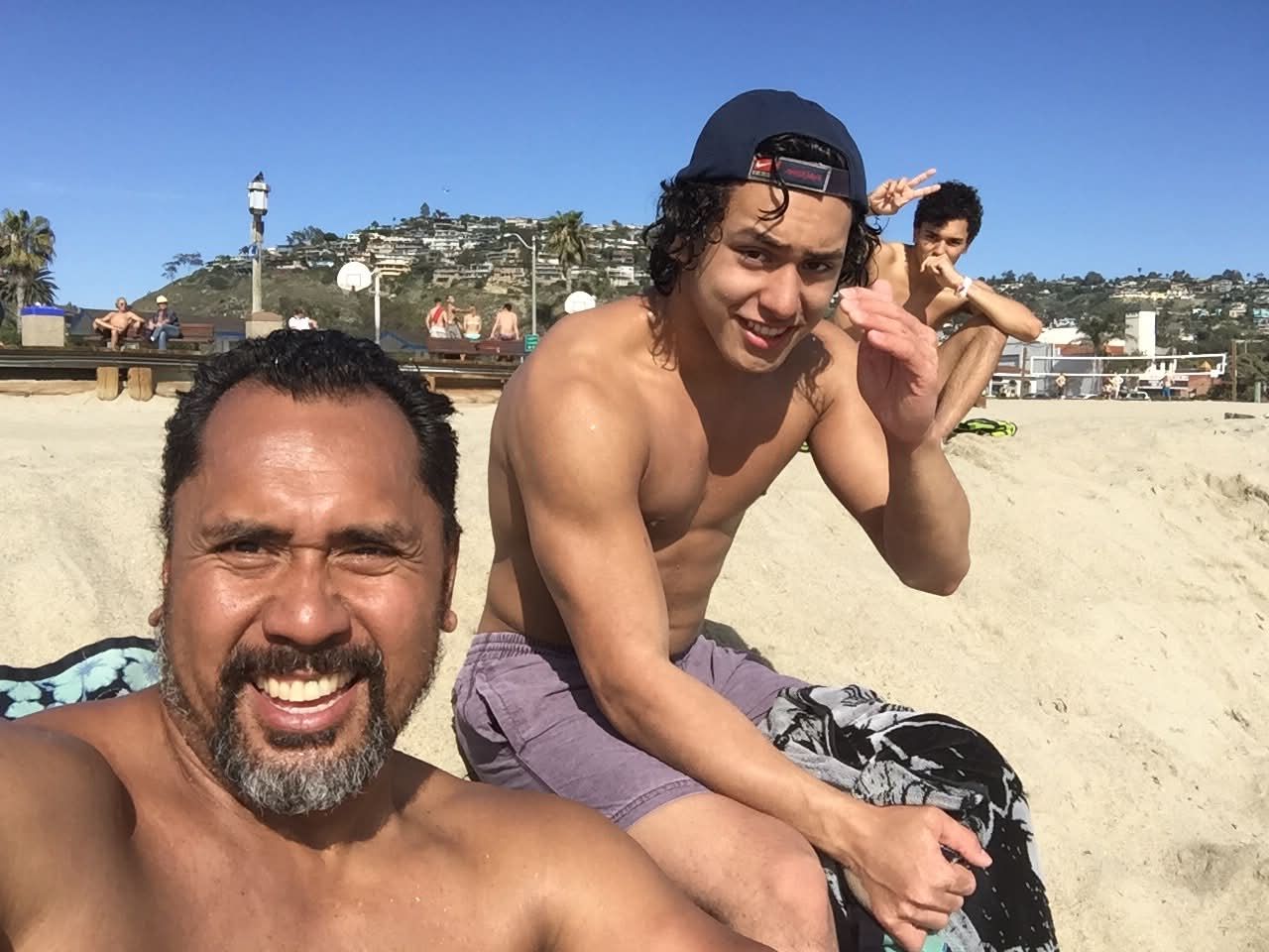 Dad with the boys at Laguna Beach volleyball courts