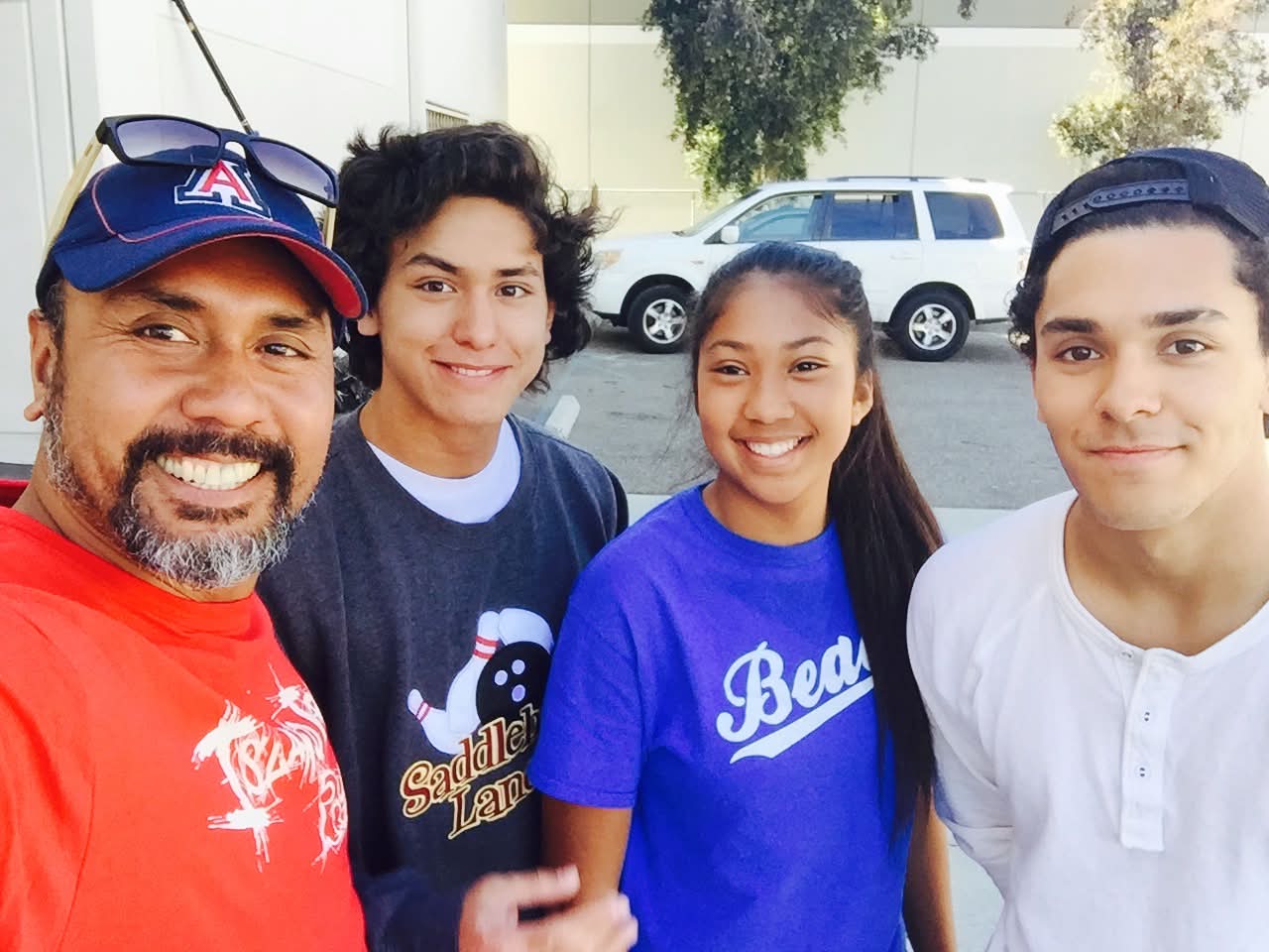 Dad with the kids in an Arizona cap
