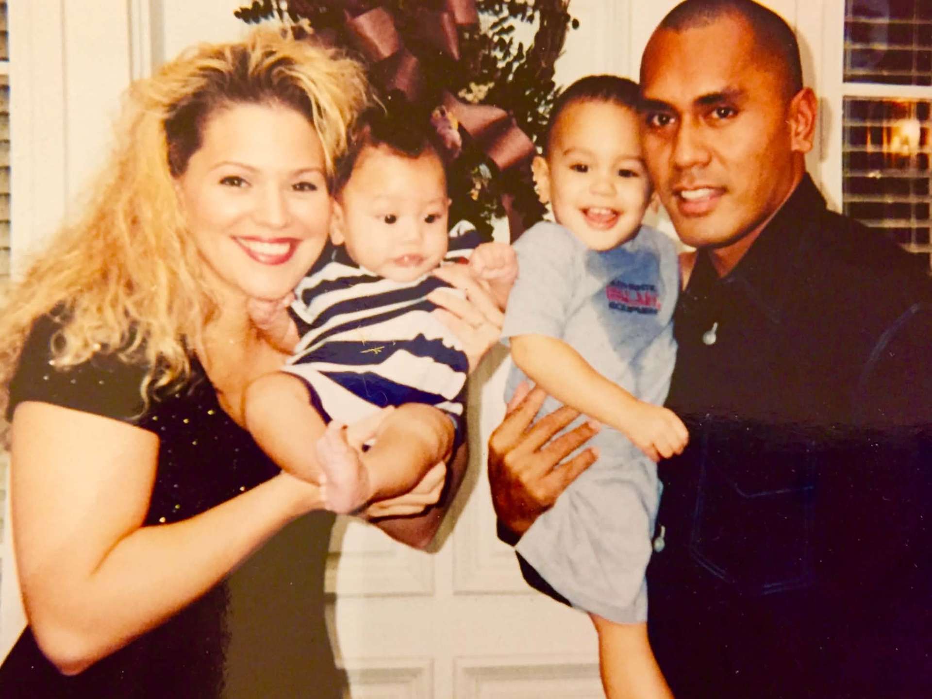 Family portrait with mom, dad and two young sons
