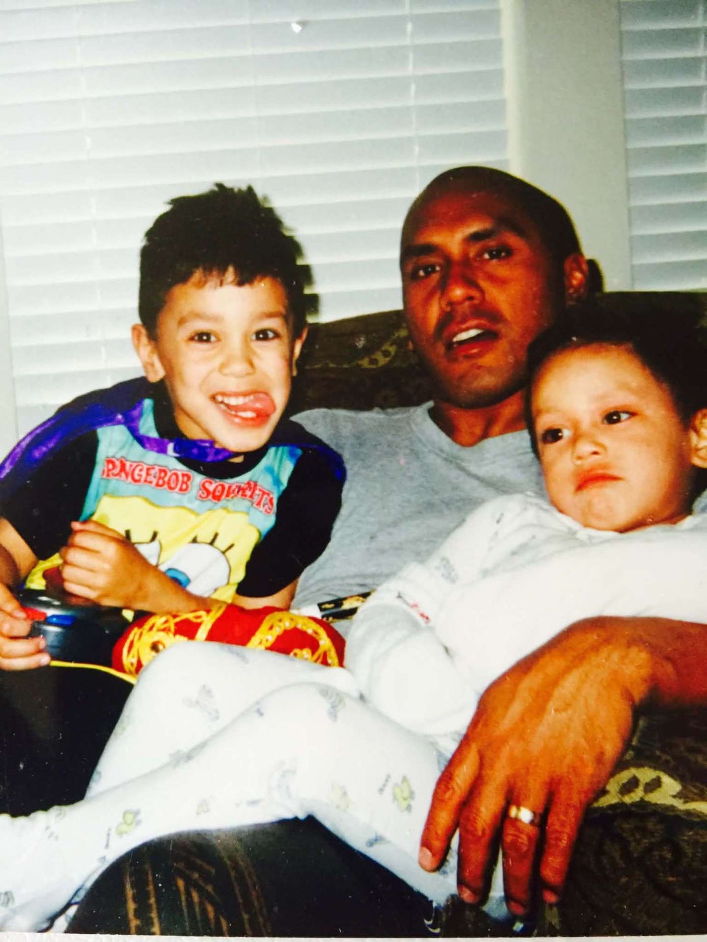 Dad on the couch with two kids
