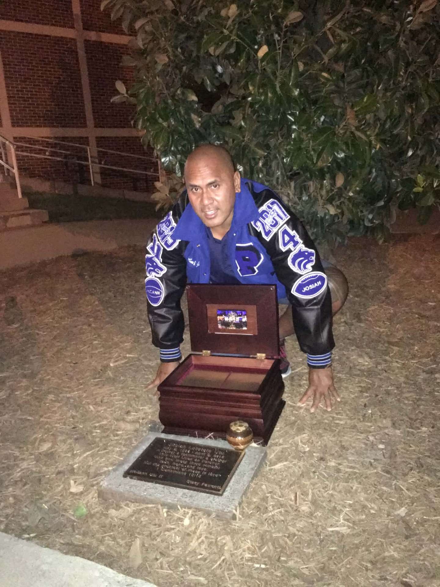 Dad in McCann and Josiah's letterman jacket at the memorial