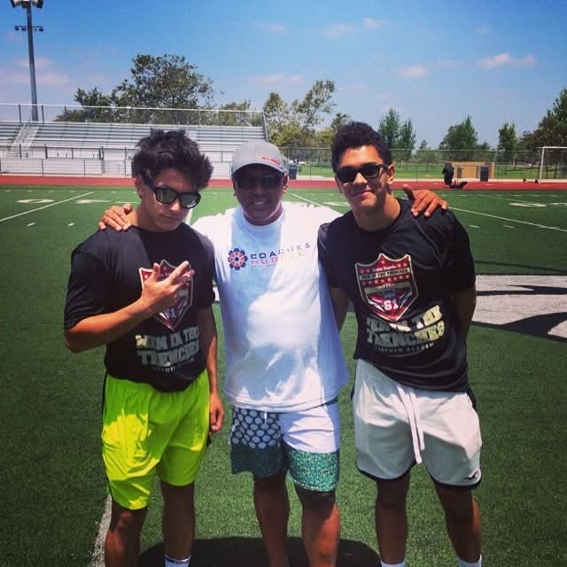 Dad with the boys at a Coaches Huddle football camp