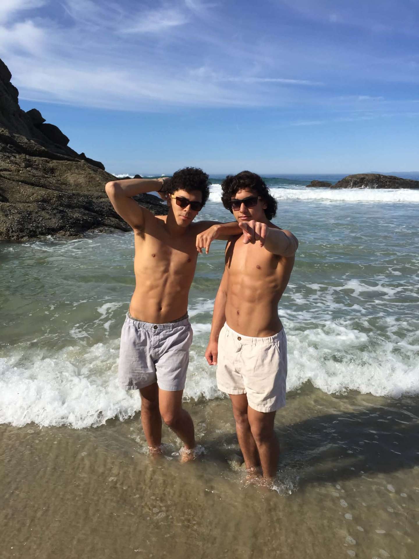McCann Jr. and Josiah posing in the surf