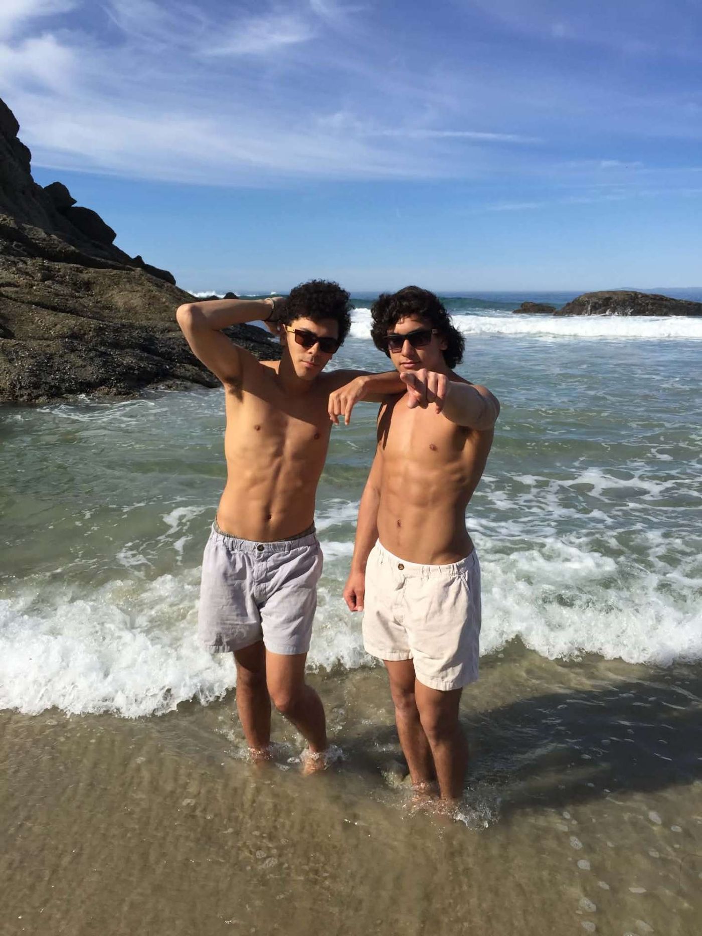 McCann Jr. and Josiah posing in the surf