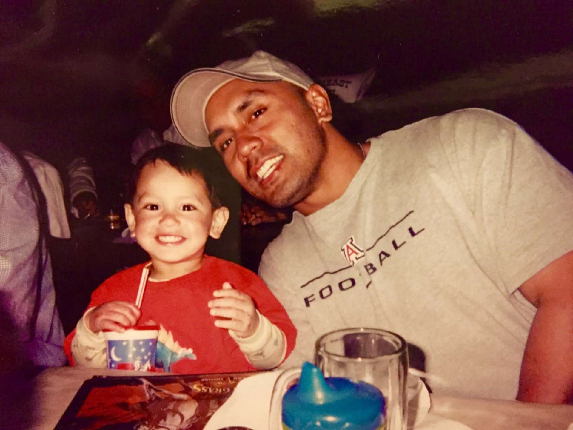 Dad in Arizona Football tee with smiling toddler